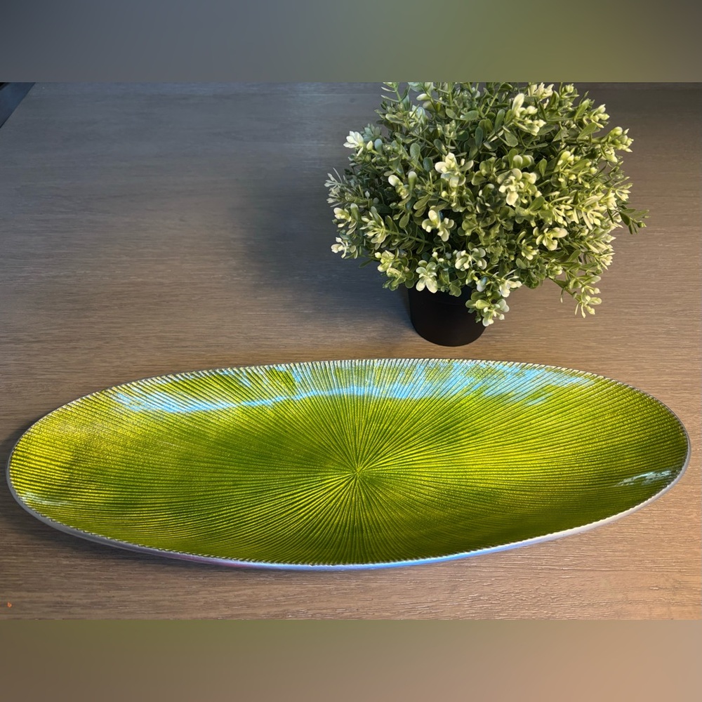 A Simplydesignz Green enamel oval bowl.